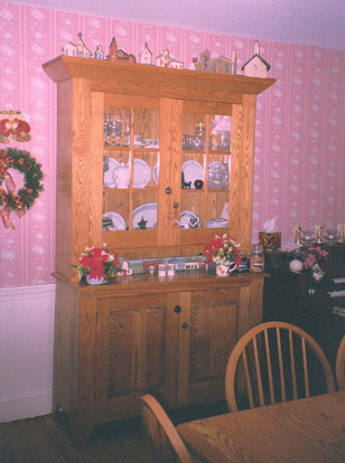 18th Century Setback Cupboard, Cheryl's Church collection on top.